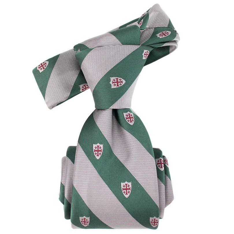 Green and white striped tie with small shields and crosses on a white background