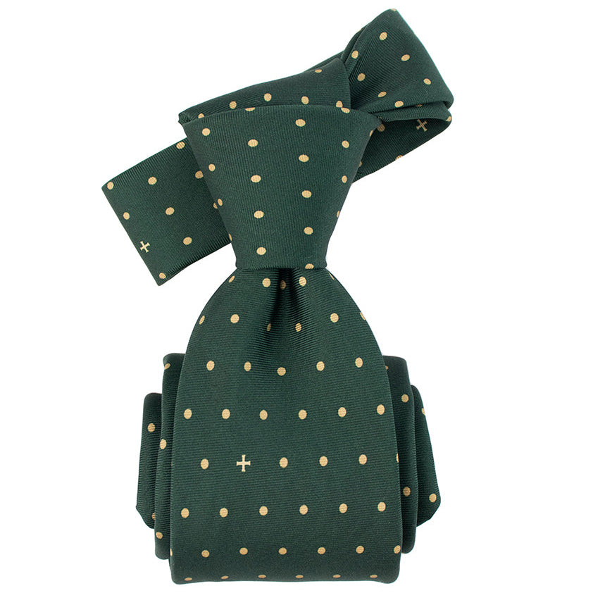 Green tie with gold polka dots on a white background
