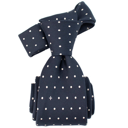 Navy blue tie with white polka dots on a white background