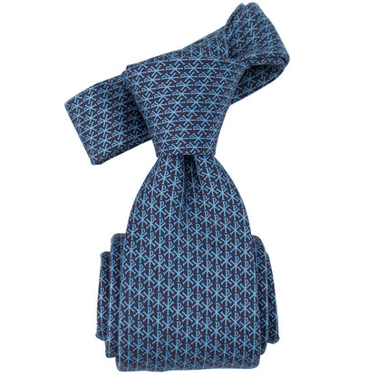 Blue patterned tie on a white background. Chi Rho micropattern premium silk Catholic necktie.